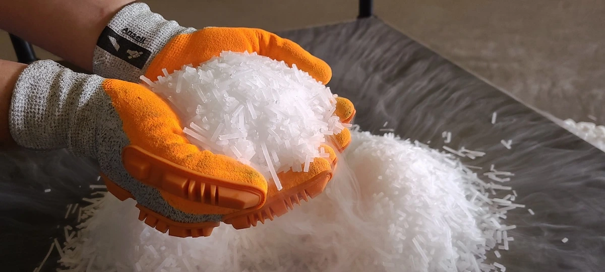 handling dry ice with gloved hands